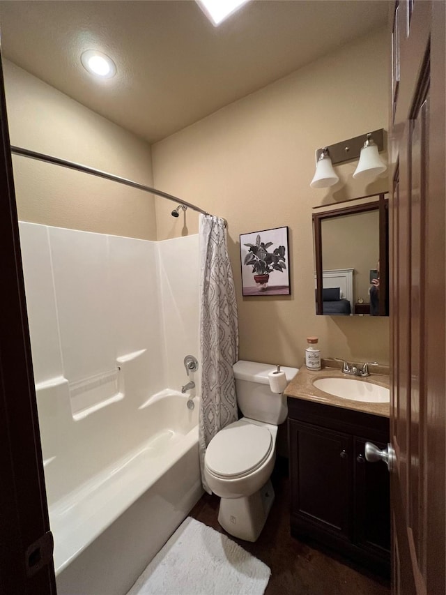 full bath with toilet, shower / tub combo with curtain, and vanity