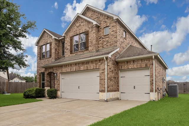 view of front of home featuring fence, a front yard, roof with shingles, central AC unit, and driveway