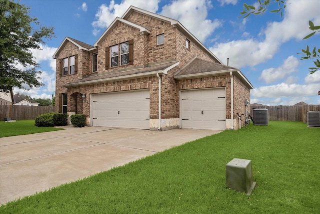 view of front of house with fence, a front yard, brick siding, an attached garage, and driveway