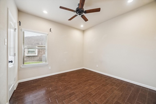 spare room featuring recessed lighting, ceiling fan, baseboards, and dark wood-type flooring