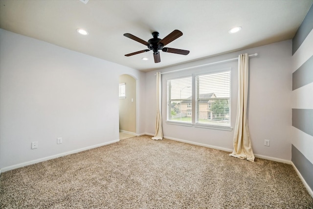 spare room featuring carpet, a ceiling fan, and recessed lighting