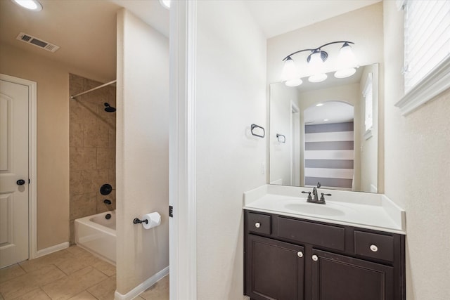 bathroom with visible vents, tile patterned flooring, shower / tub combination, vanity, and baseboards