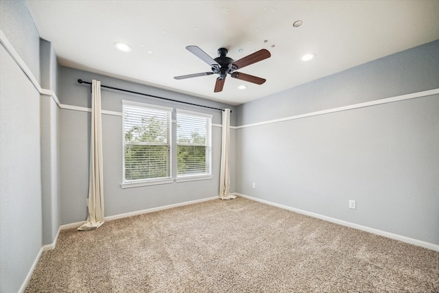 carpeted spare room featuring baseboards, ceiling fan, and recessed lighting