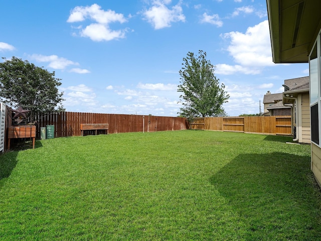 view of yard featuring a fenced backyard