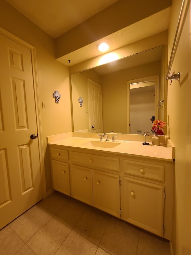 bathroom featuring tile patterned floors and vanity