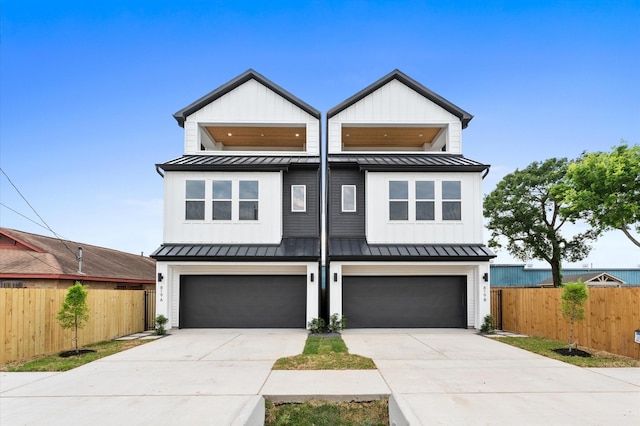 819 Dorothy St Unit A, Houston, TX 77008 - view of front of home with a standing seam roof, metal roof, a garage, and driveway