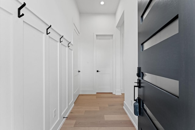 interior space featuring light wood-style floors, recessed lighting, and baseboards