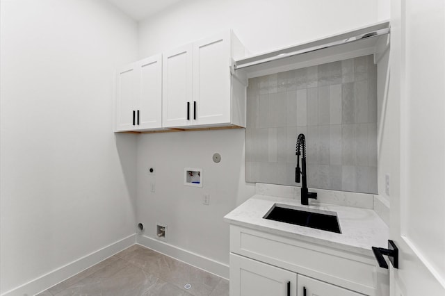laundry room with cabinet space, washer hookup, baseboards, hookup for a gas dryer, and hookup for an electric dryer