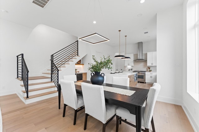 819 Dorothy St Unit A, Houston, TX 77008 - dining space with stairs, light wood-style floors, recessed lighting, and baseboards