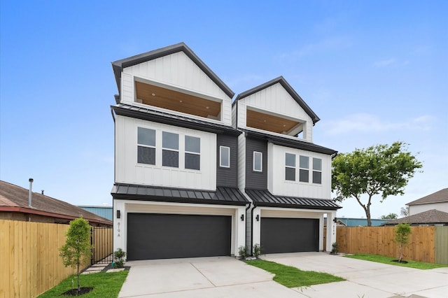 819 Dorothy St Unit A, Houston, TX 77008 - view of front of home featuring a standing seam roof, an attached garage, concrete driveway, and board and batten siding