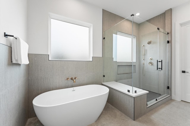 819 Dorothy St Unit A, Houston, TX 77008 - full bath featuring a stall shower, a freestanding tub, tile walls, and wainscoting