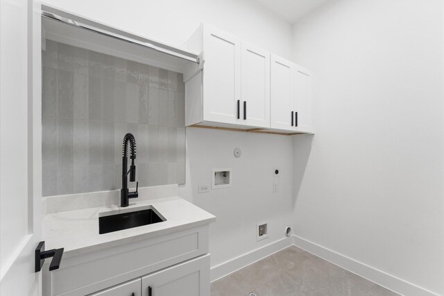 819 Dorothy St Unit A, Houston, TX 77008 - laundry room with hookup for an electric dryer, hookup for a washing machine, cabinet space, hookup for a gas dryer, and baseboards