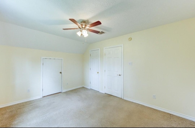 20610 Live Oak Dr, Damon, TX 77430 - unfurnished bedroom featuring light colored carpet, baseboards, a ceiling fan, and vaulted ceiling
