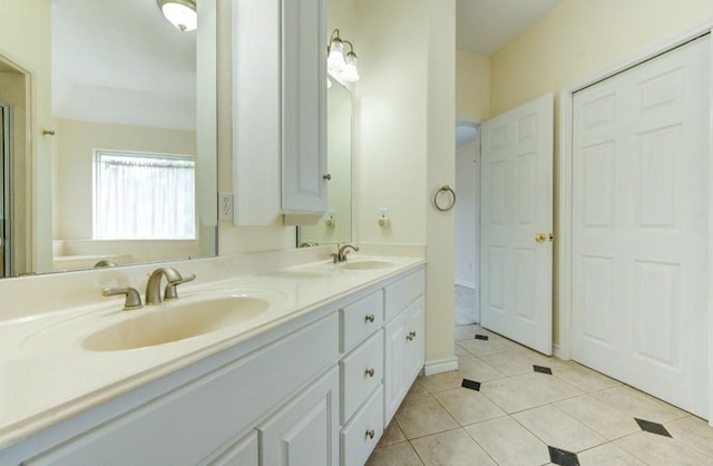 20610 Live Oak Dr, Damon, TX 77430 - bathroom with double vanity and tile patterned flooring
