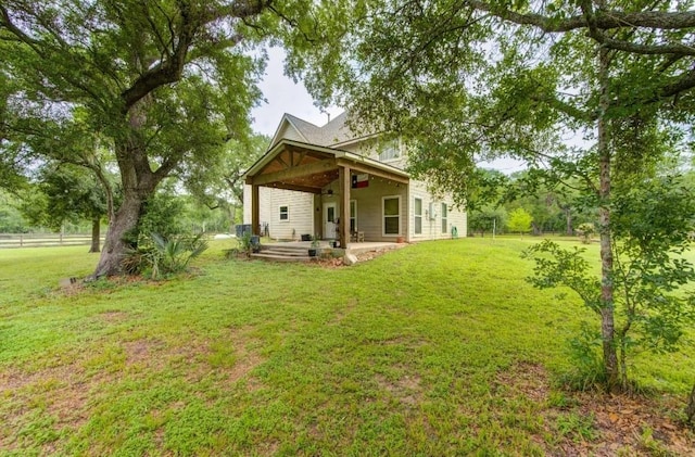 20610 Live Oak Dr, Damon, TX 77430 - rear view of property with a patio and a yard