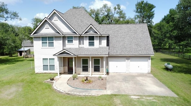 20610 Live Oak Dr, Damon, TX 77430 - view of front of house featuring an attached garage, driveway, stone siding, and a shingled roof