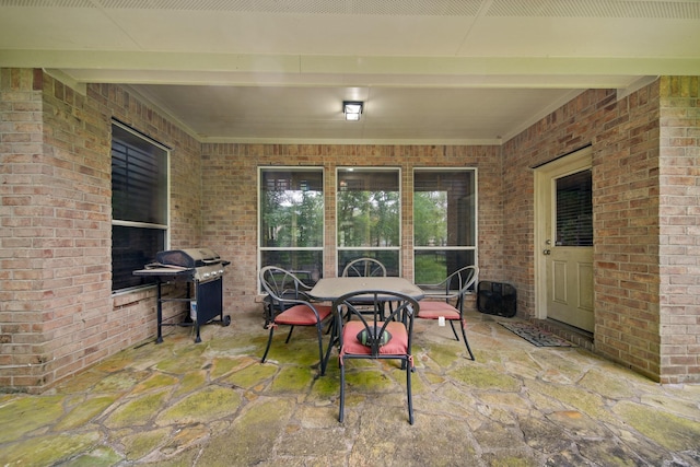 view of patio / terrace with outdoor dining space and grilling area