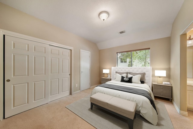 bedroom with baseboards, visible vents, and light colored carpet