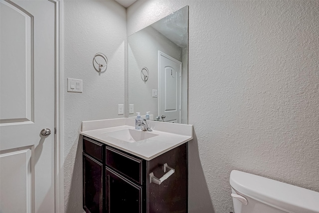 15314 Stulan Burn Dr, Humble, TX 77346 - bathroom featuring vanity, a textured wall, and toilet