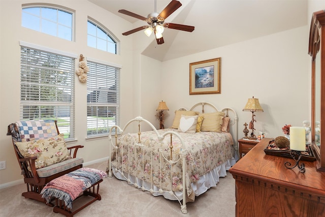 bedroom featuring baseboards, light carpet, and lofted ceiling