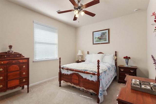 bedroom with baseboards, a ceiling fan, carpet flooring, and visible vents