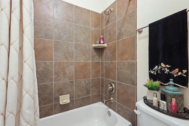 bathroom featuring toilet and shower / tub combo