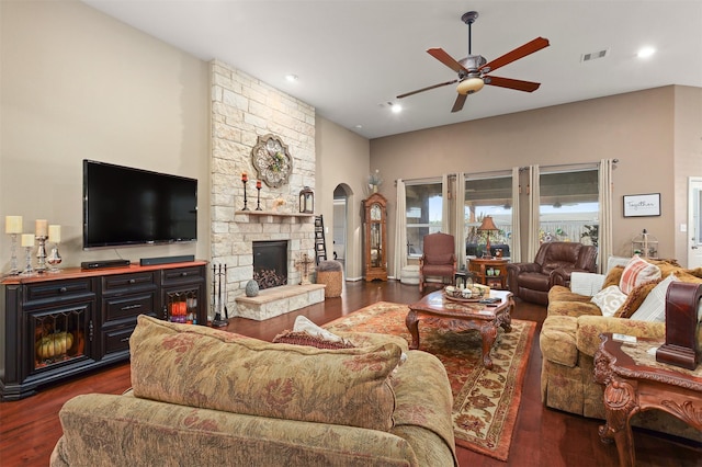 living area featuring ceiling fan, visible vents, a fireplace, dark wood-style floors, and recessed lighting