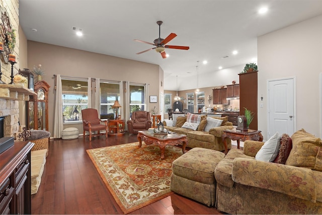 living area with dark wood-style flooring, a ceiling fan, and recessed lighting