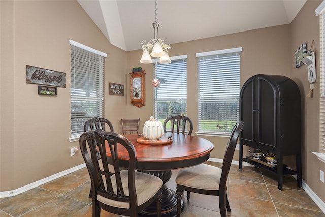 tiled dining area with baseboards, a chandelier, and lofted ceiling