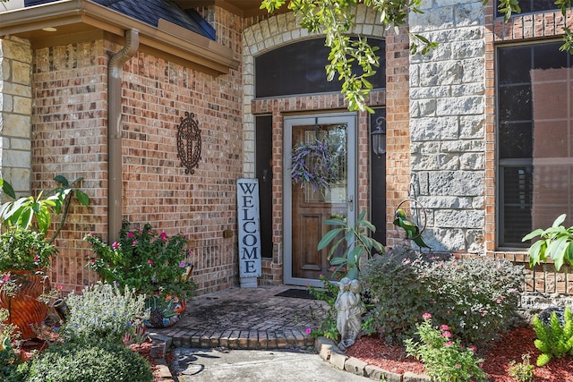 entrance to property with brick siding