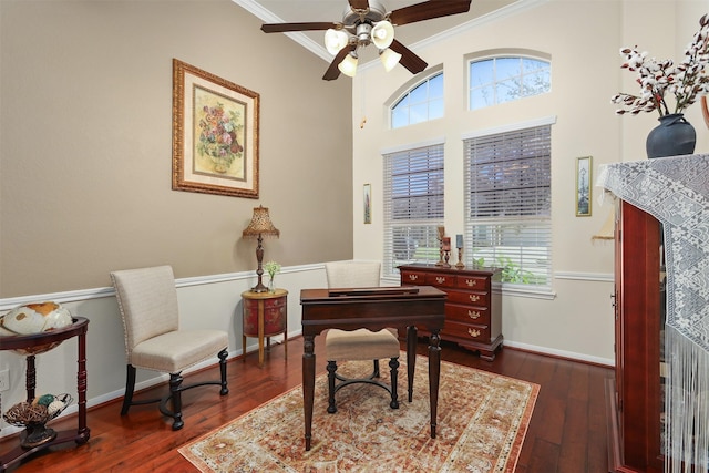 office space with crown molding, a ceiling fan, plenty of natural light, and dark wood-style floors
