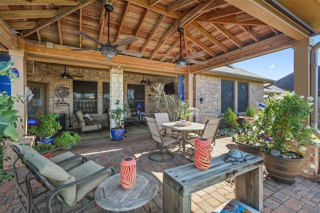 view of patio with outdoor dining space and ceiling fan