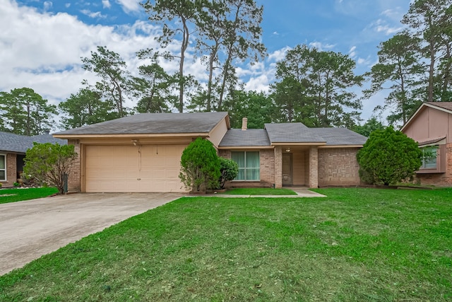 view of front of home with brick siding, a garage, a front lawn, and driveway
