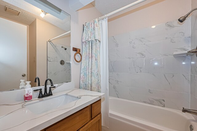 bathroom featuring vanity, shower / bathtub combination with curtain, and visible vents