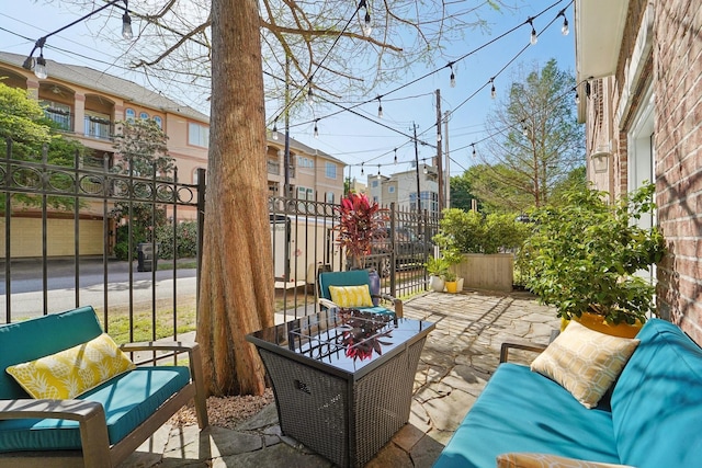 view of patio / terrace featuring fence and an outdoor living space
