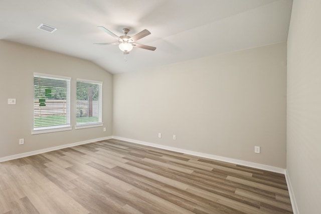 5030 Magnolia Springs Dr, Pearland, TX 77584 - spare room featuring a ceiling fan, light wood finished floors, baseboards, and vaulted ceiling