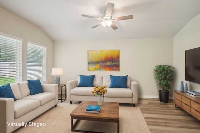 5030 Magnolia Springs Dr, Pearland, TX 77584 - living area with light wood-style flooring, ceiling fan, baseboards, and vaulted ceiling