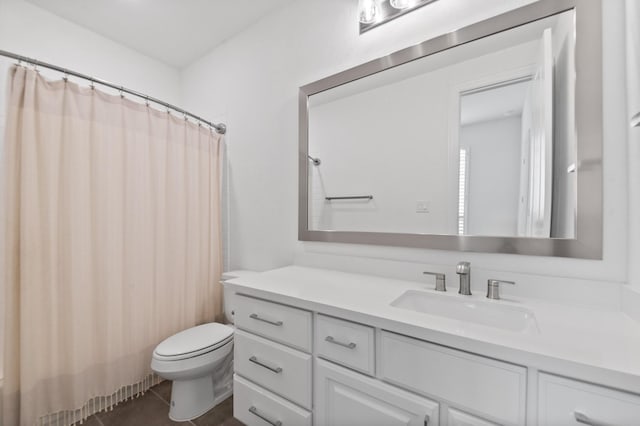 bathroom with toilet, tile patterned floors, a shower with shower curtain, and vanity