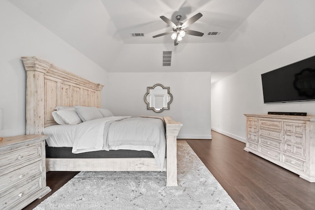 bedroom with a ceiling fan, lofted ceiling, dark wood-style flooring, and visible vents