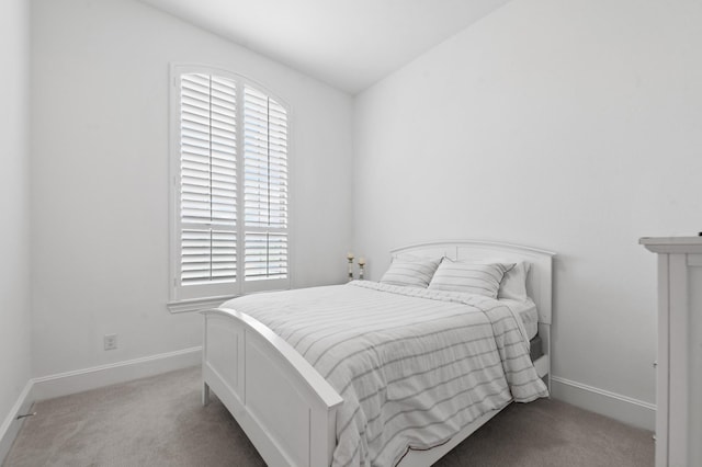 carpeted bedroom with baseboards