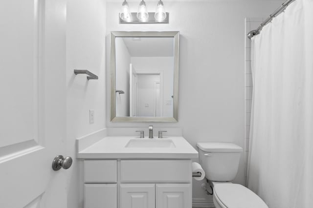 full bath with vanity and toilet