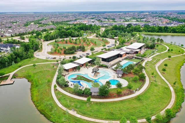 birds eye view of property with a water view