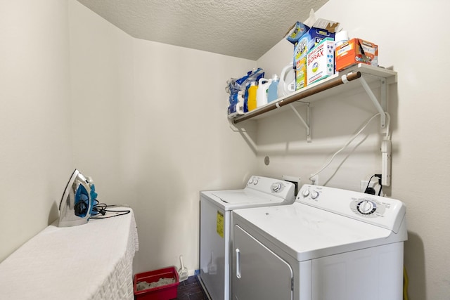 19527 Hardwood Ridge Trl, Cypress, TX 77429 - washroom featuring washing machine and clothes dryer and a textured ceiling