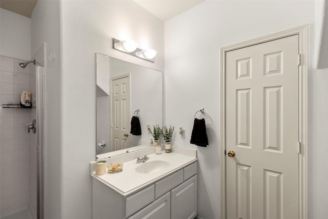 bathroom featuring vanity and a stall shower