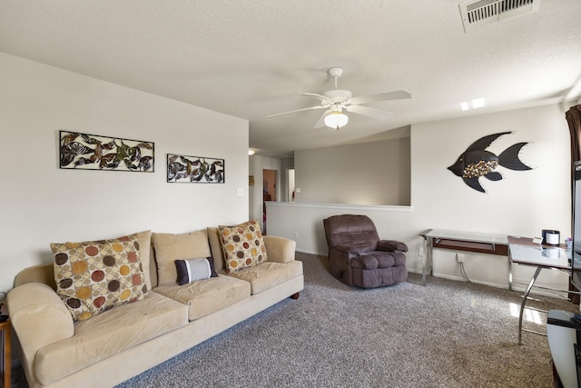 living area with carpet flooring, a ceiling fan, a textured ceiling, and visible vents
