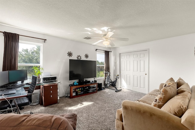 19527 Hardwood Ridge Trl, Cypress, TX 77429 - living area featuring carpet, a ceiling fan, a textured ceiling, and a desk