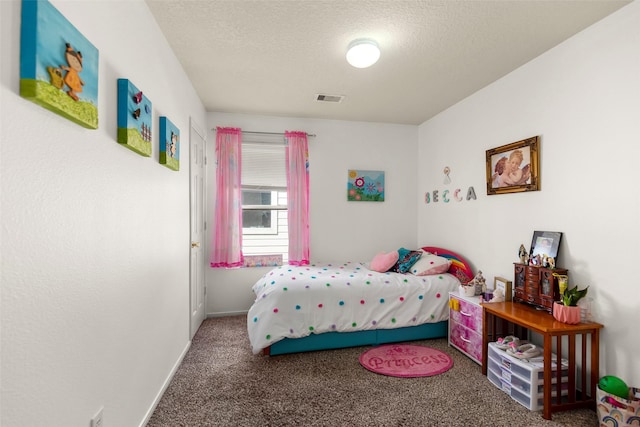 bedroom featuring carpet floors, baseboards, a textured ceiling, and visible vents