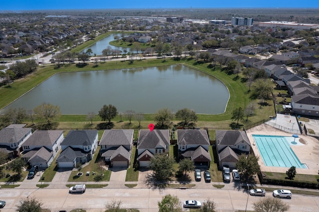 aerial view with a water view and a residential view