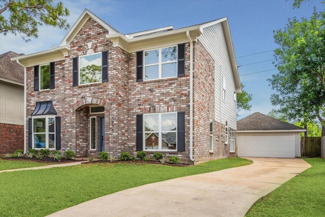 view of front of home featuring brick siding, a garage, and a front yard