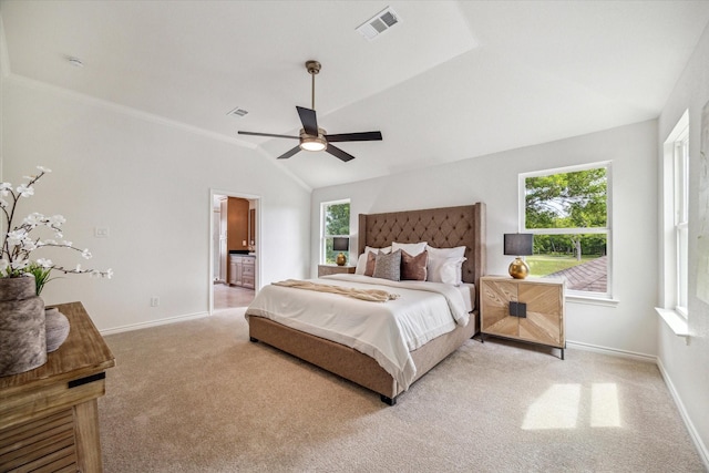bedroom with multiple windows and light colored carpet